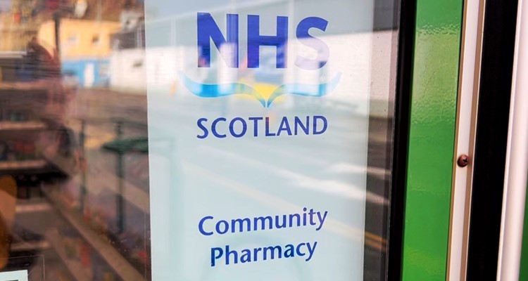 NHS Scotland community pharmacy sign on door