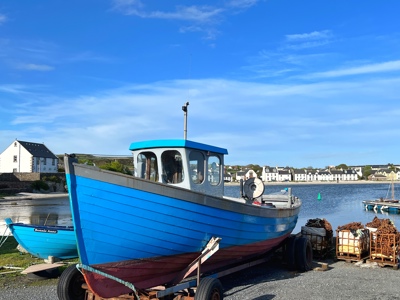 small fishing boats by a jetty in Port Ellen, Islay