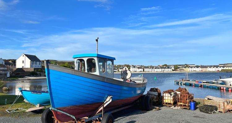 small fishing boats by a jetty in Port Ellen, Islay
