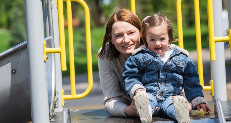 Smiling Mother And Child On Climbing Frame