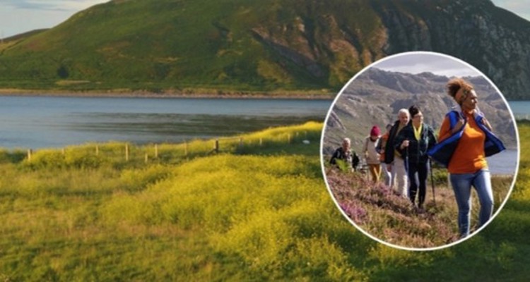 People Walking In Highland Landscape