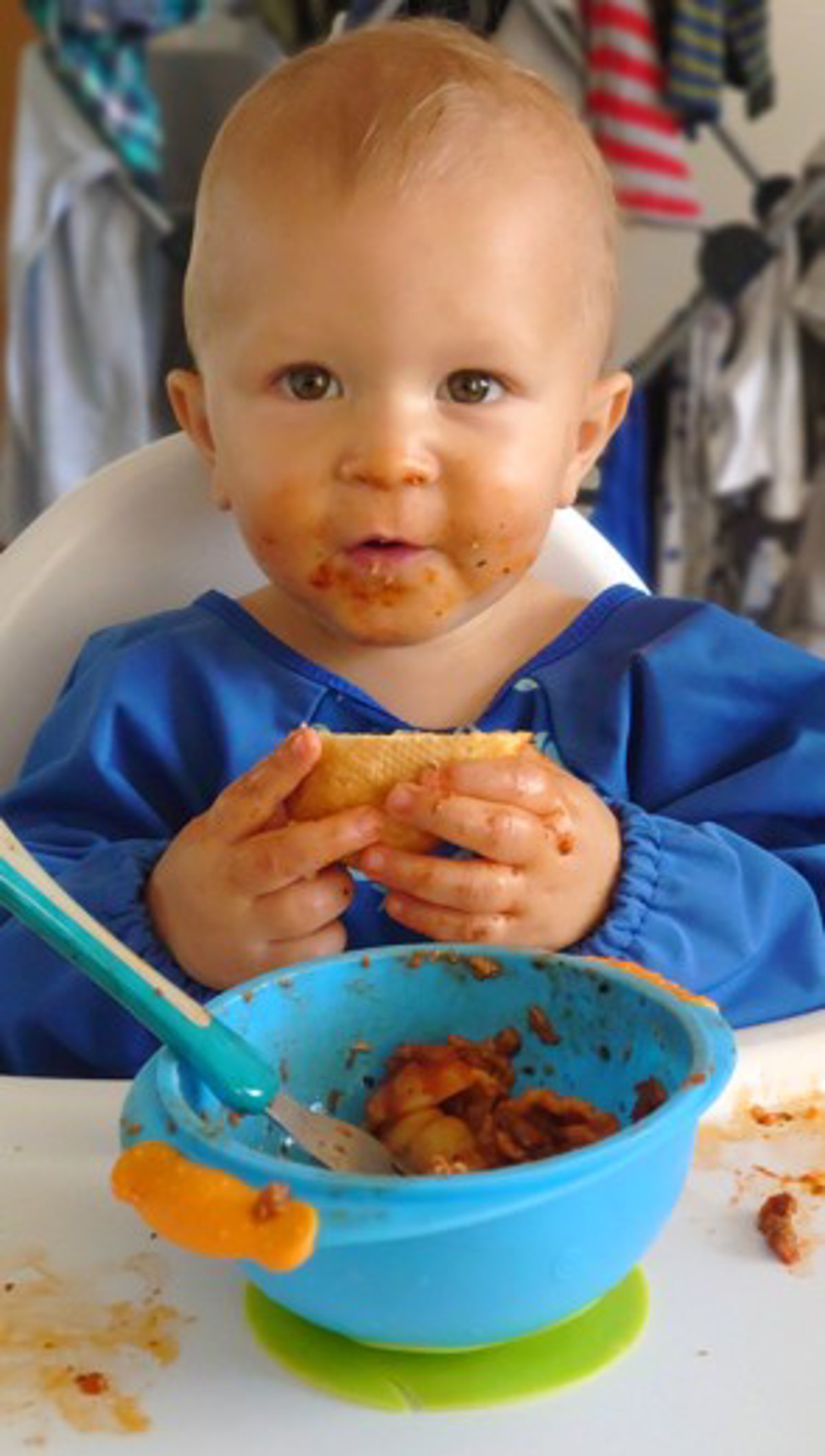 Baby In High Chair Eating Solid Food 0