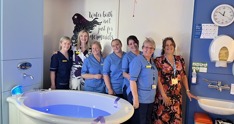 nurses and NHS staff around a birthing pool