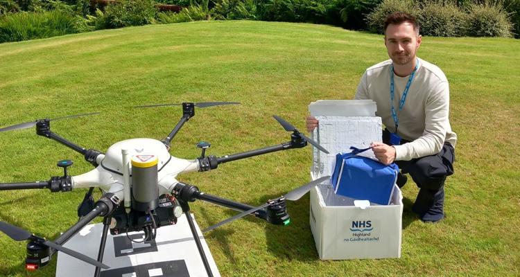 drone and operator in field outdoors