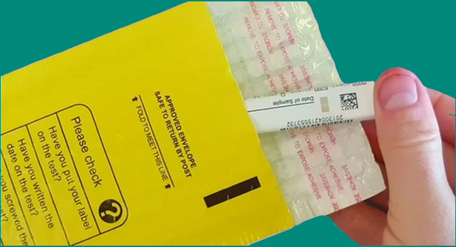 The bowel screening plastic sample tube being placed into a padded envelope