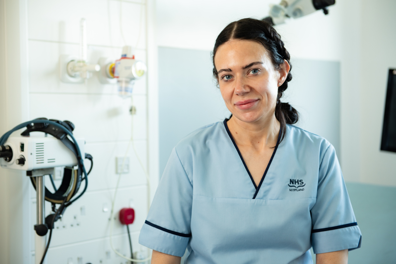 Nurse Sitting In A Treatment Room