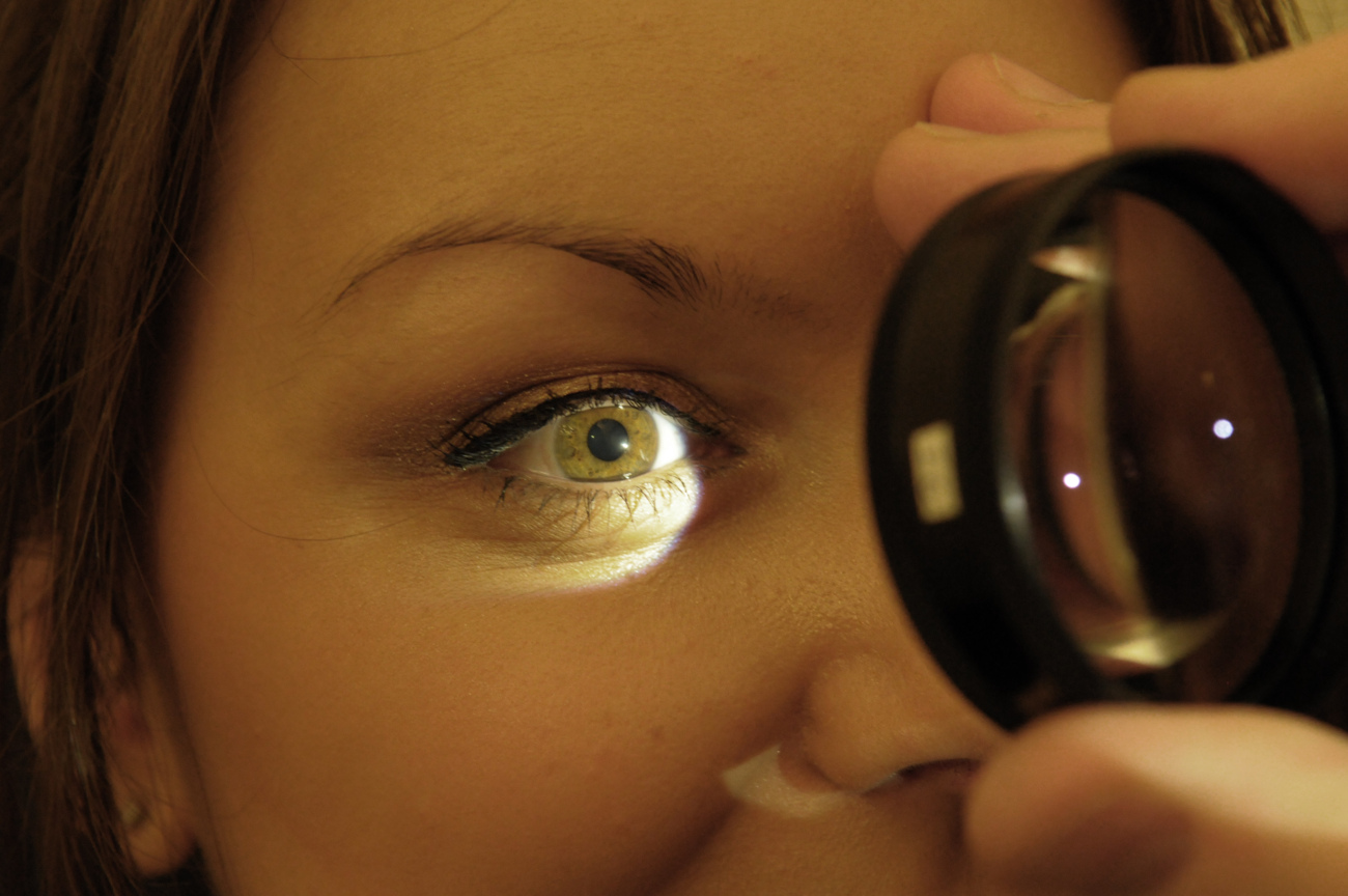 Ophthalmology Patient Receiving Eye Examination With Magnifier Lens